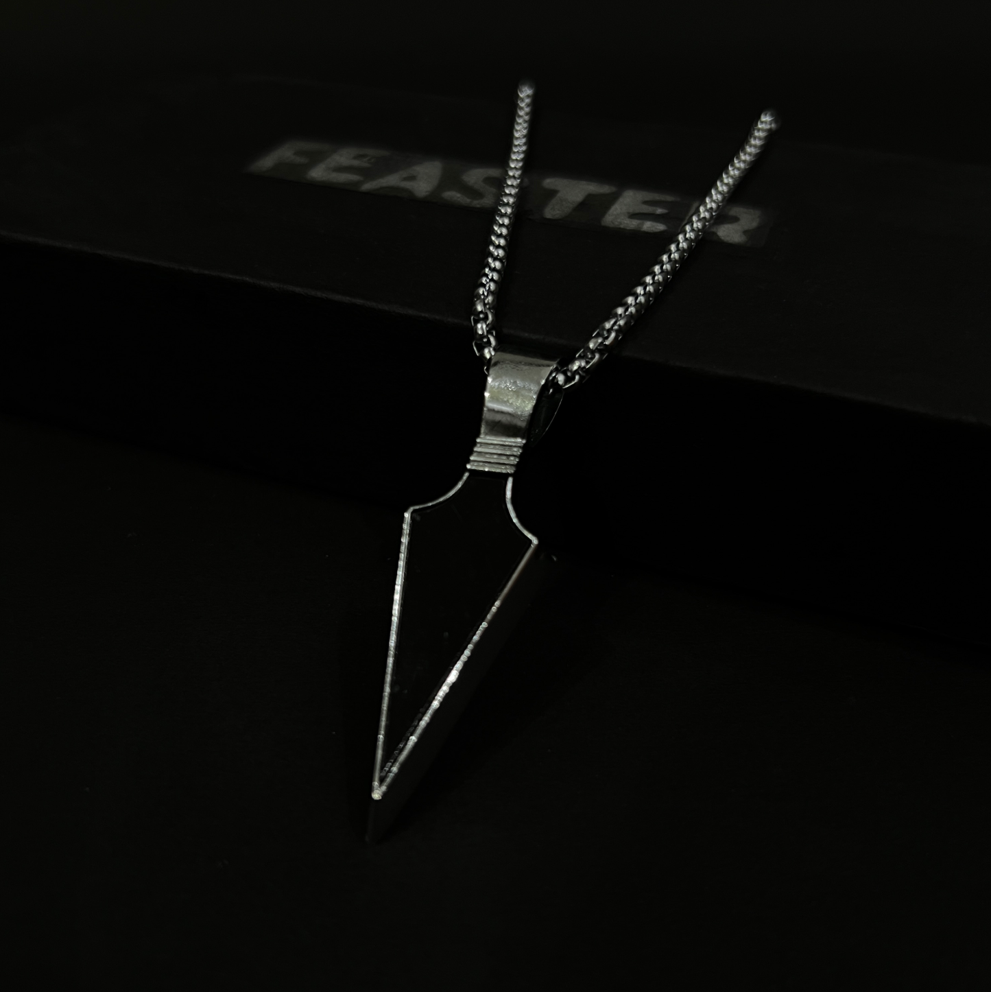 Black stone arrow pendant with chain